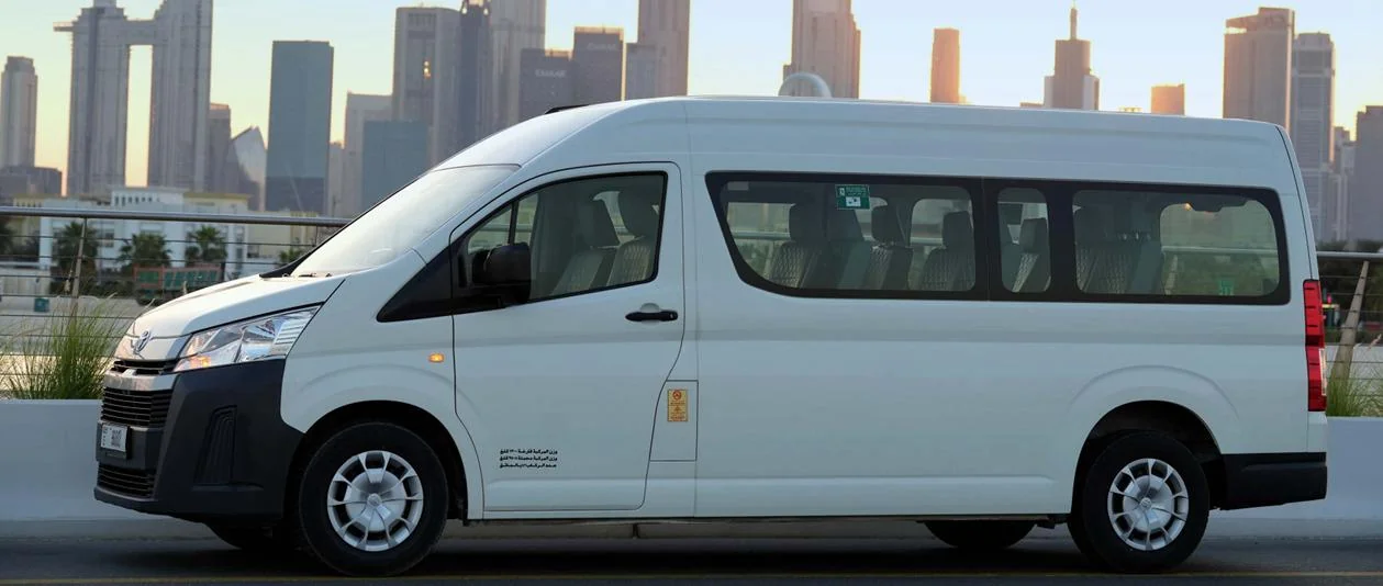 Standard bus rental Dubai Sharjah Abu Dhabi - Toyota Coaster Hiace group transfer UAE